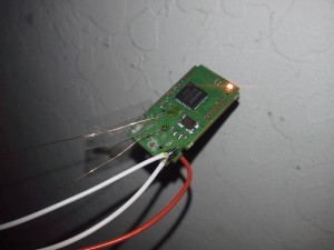 Picture of wires solderd to broken USB flash drive